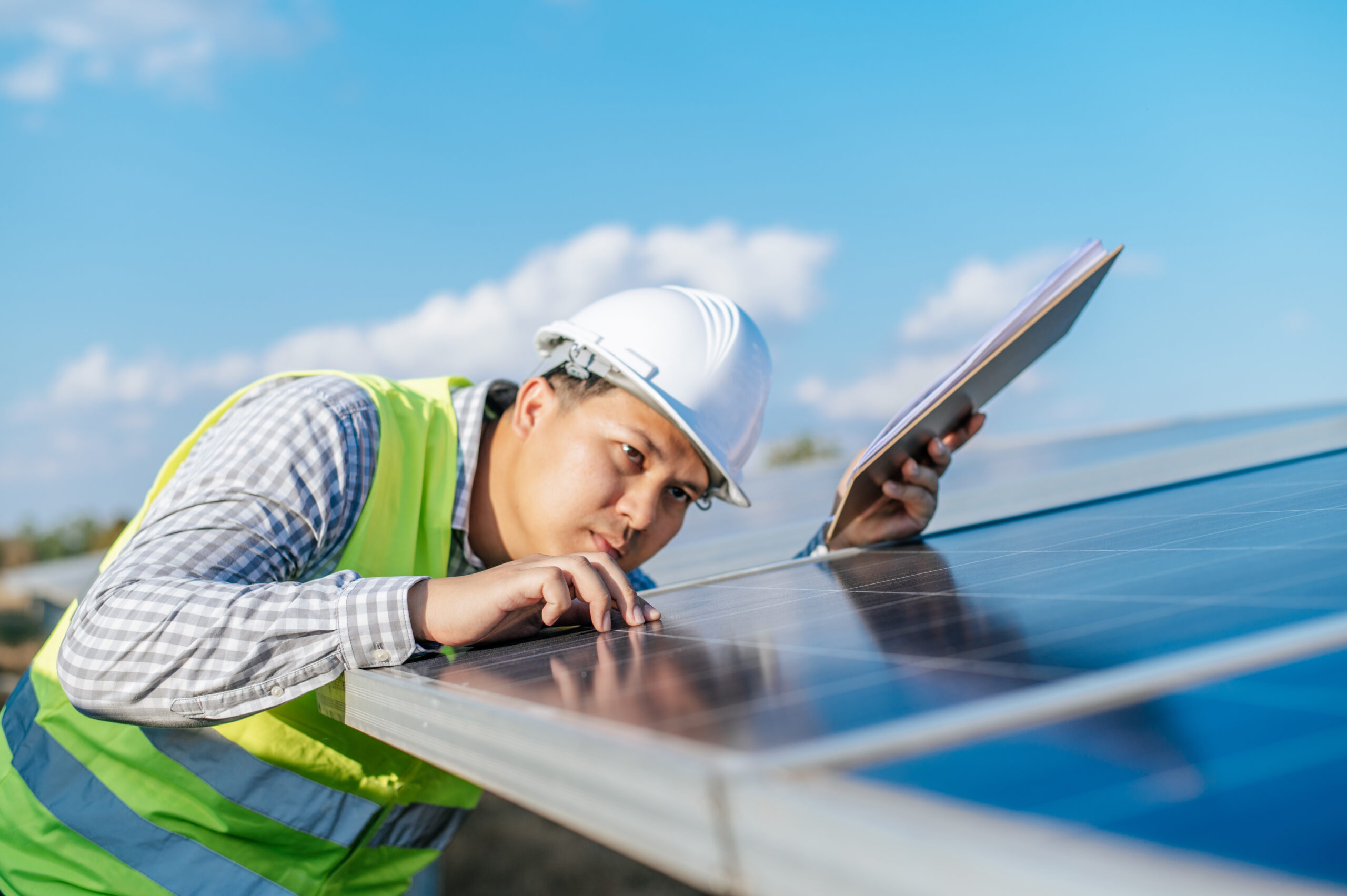 engineer checking solar panels